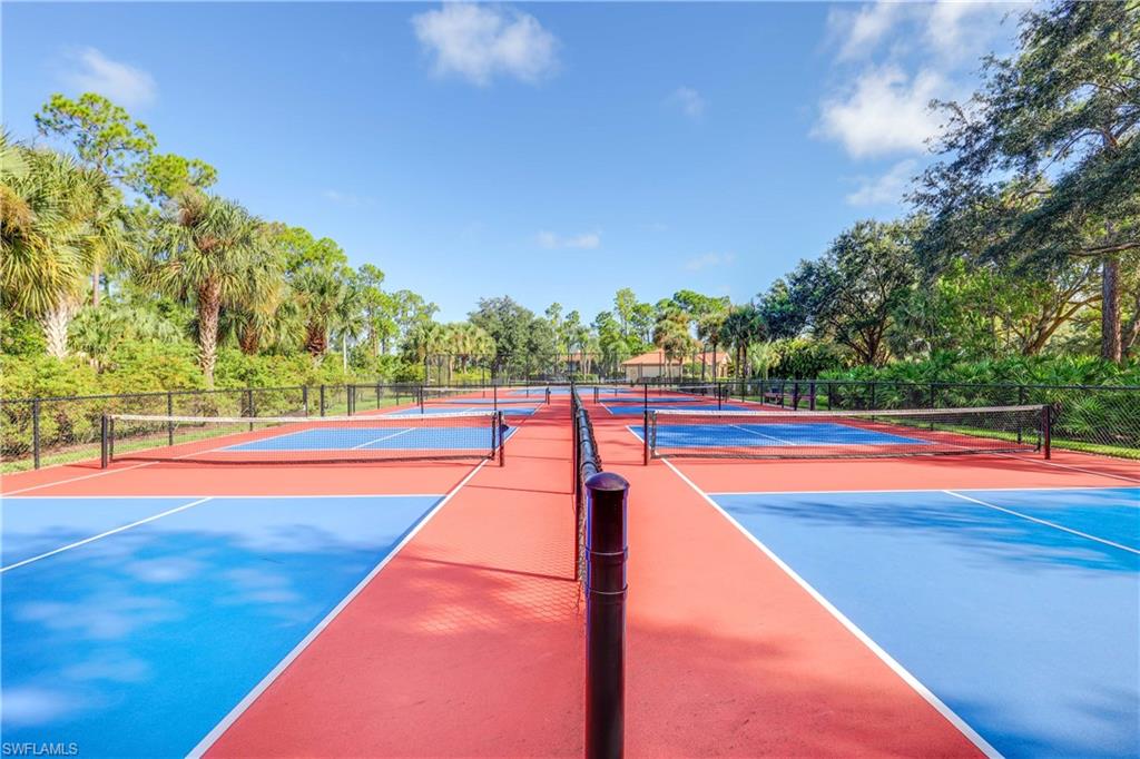 290 Robin Hood Circle, Unit 201 Naples, FL 34104 - Photo 31 of 34 a view of swimming pool with an outdoor seating