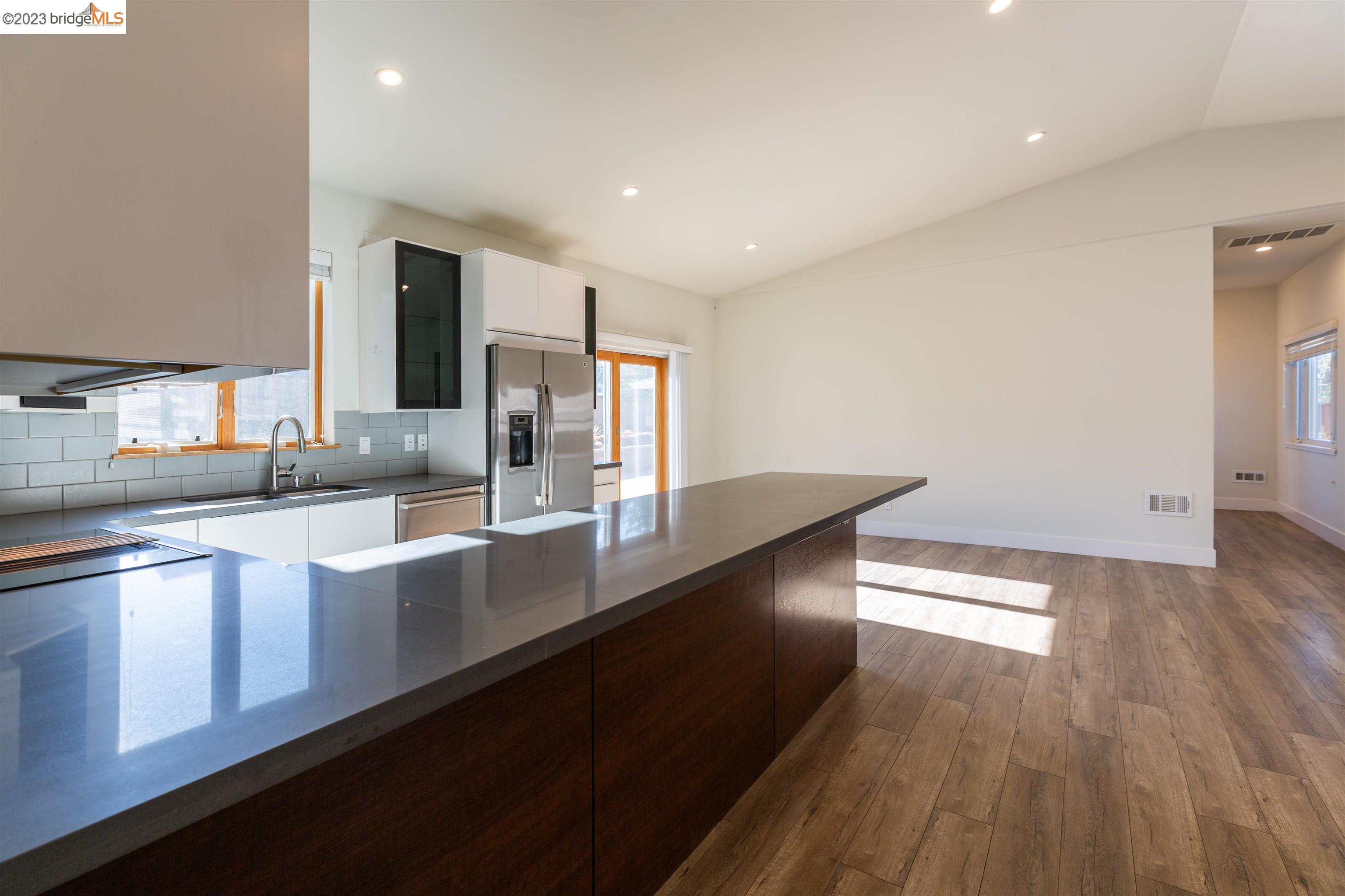 2191 Pleasant Hill Road Pleasant Hill, CA 94523 - Photo 12 of 35 a large kitchen with stainless steel appliances a large counter top a sink a refrigerator and a stove