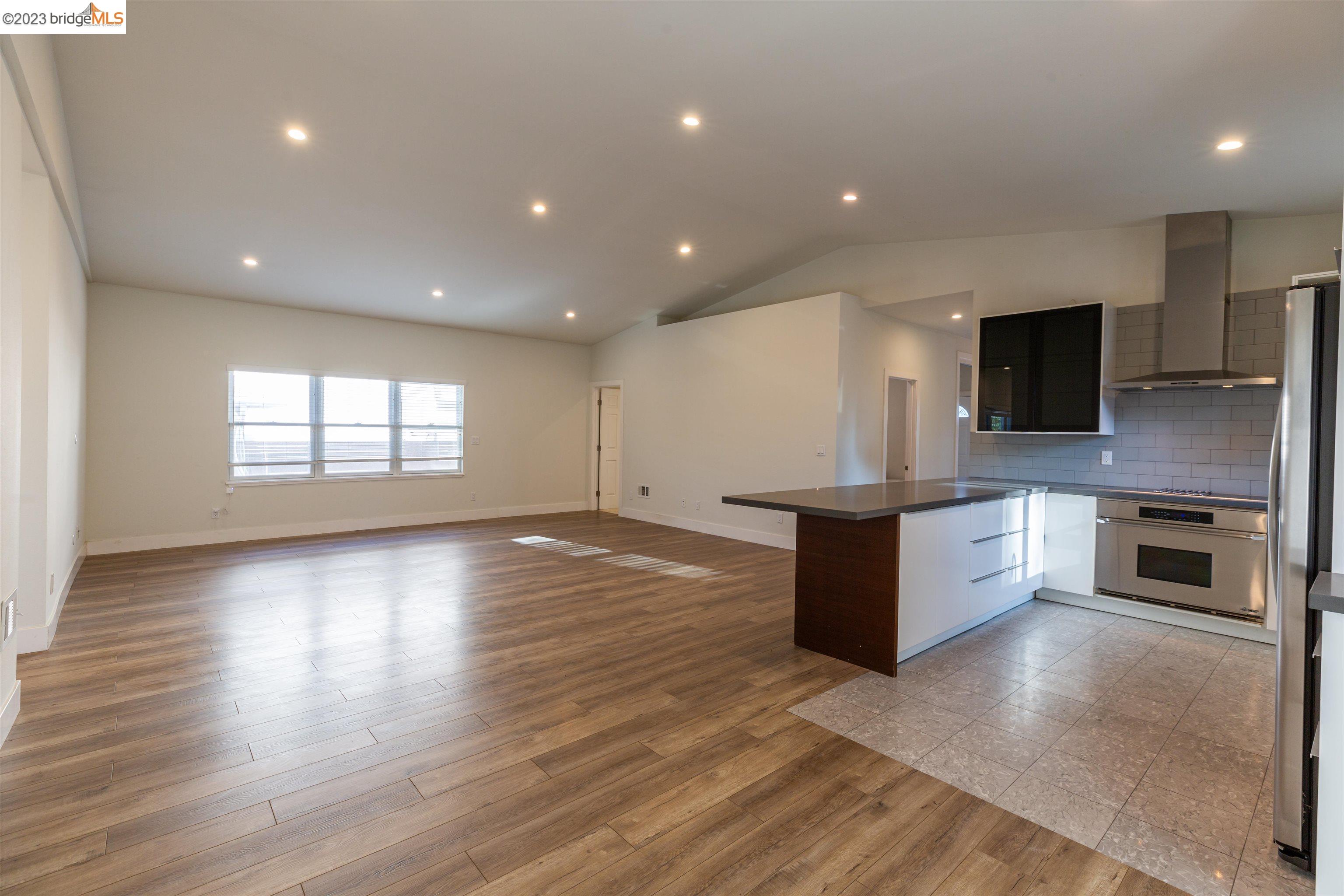 2191 Pleasant Hill Road Pleasant Hill, CA 94523 - Photo 14 of 35 a large kitchen with stainless steel appliances granite countertop a stove a sink and a refrigerator