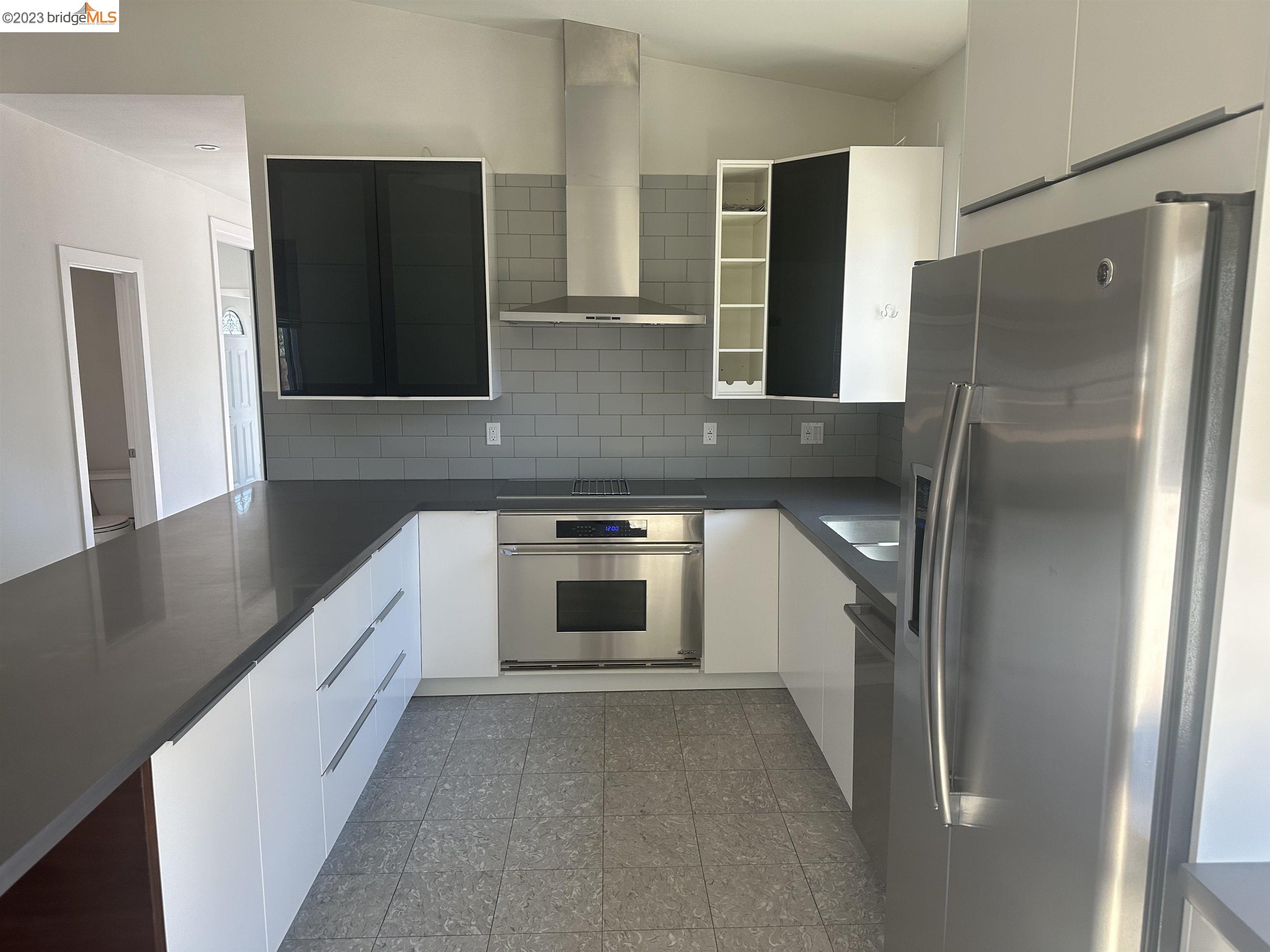 2191 Pleasant Hill Road Pleasant Hill, CA 94523 - Photo 16 of 35 a kitchen with stainless steel appliances a refrigerator and a sink