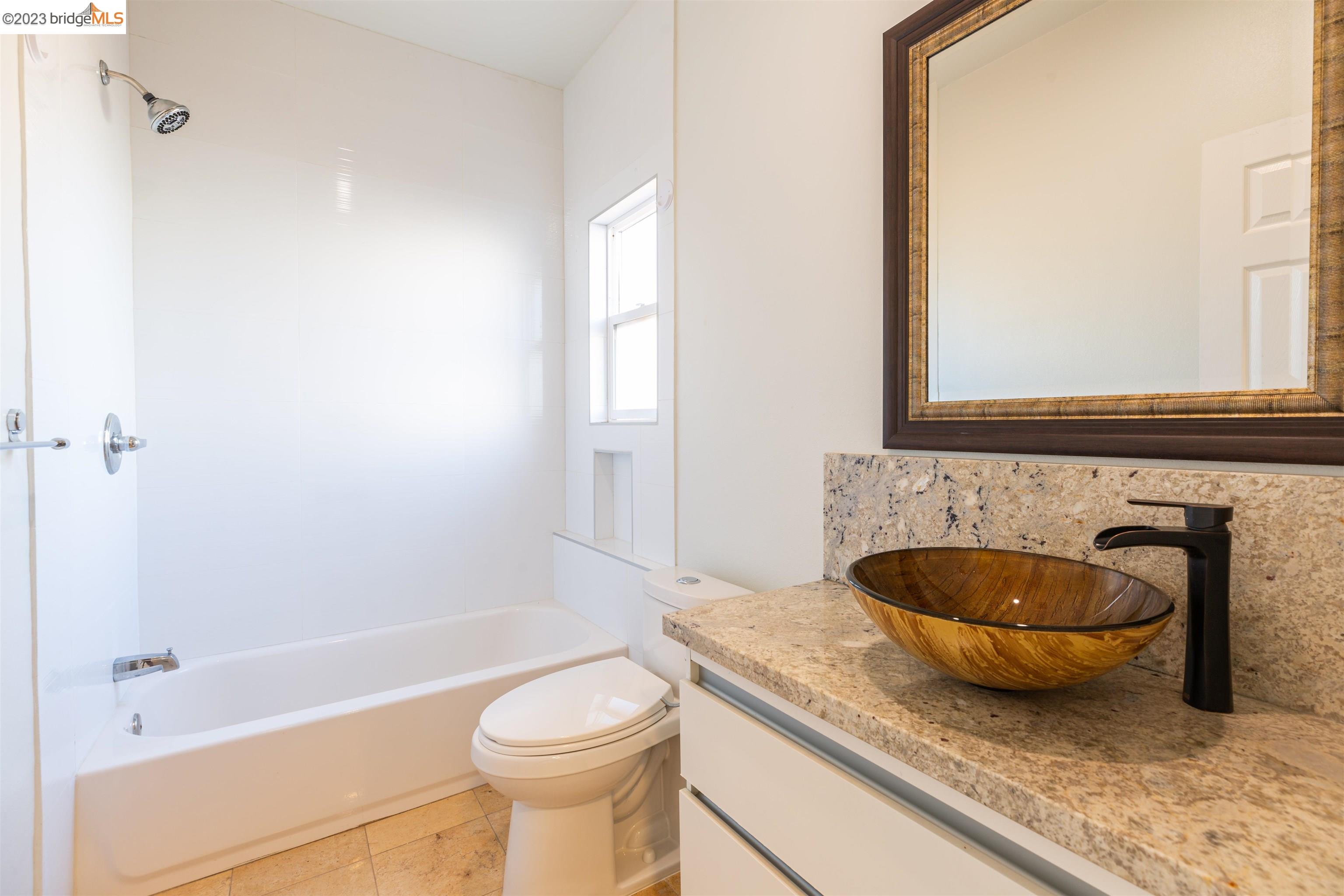 2191 Pleasant Hill Road Pleasant Hill, CA 94523 - Photo 20 of 35 a bathroom with a granite countertop toilet and a sink