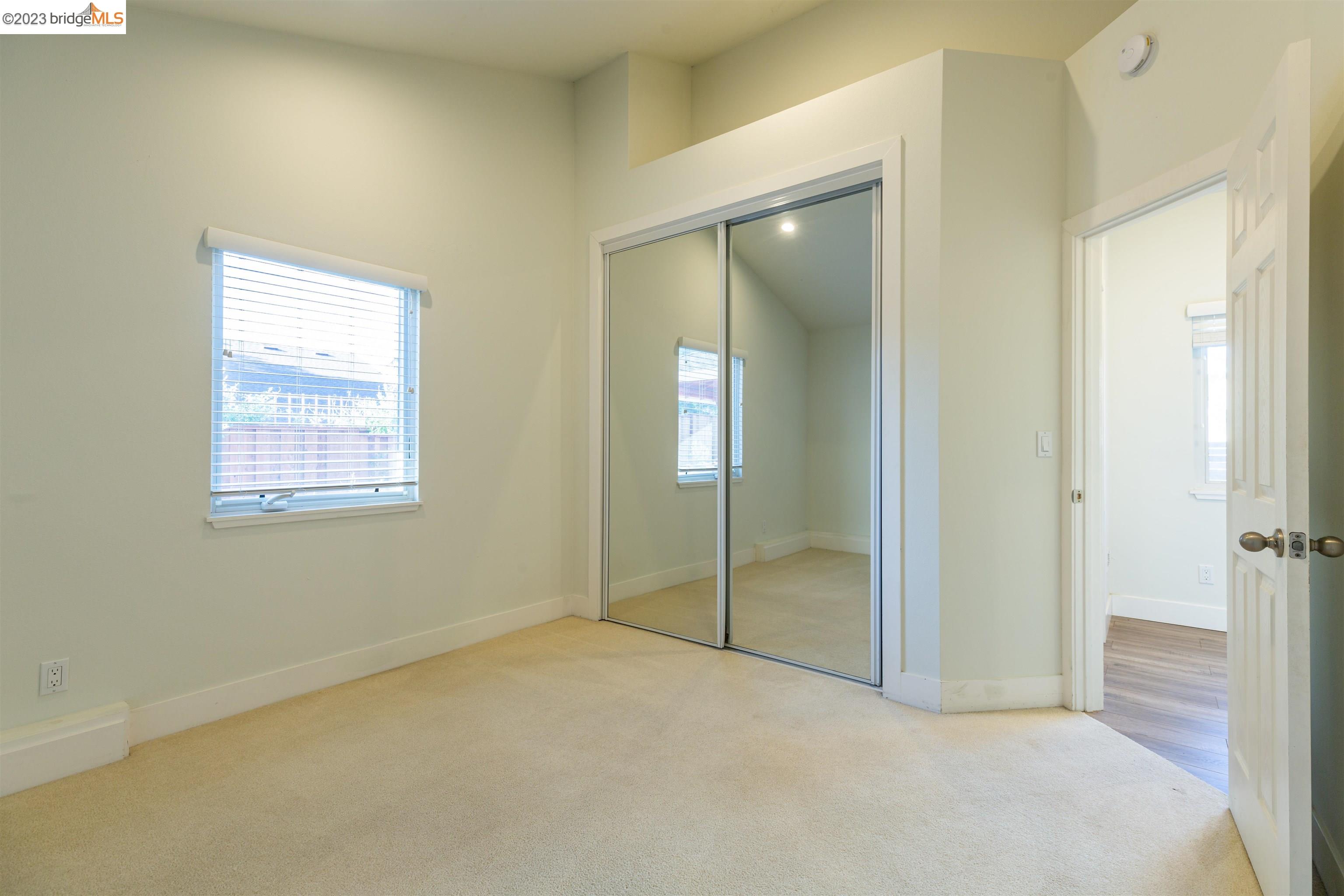 2191 Pleasant Hill Road Pleasant Hill, CA 94523 - Photo 21 of 35 a view of an empty room with closet and a window