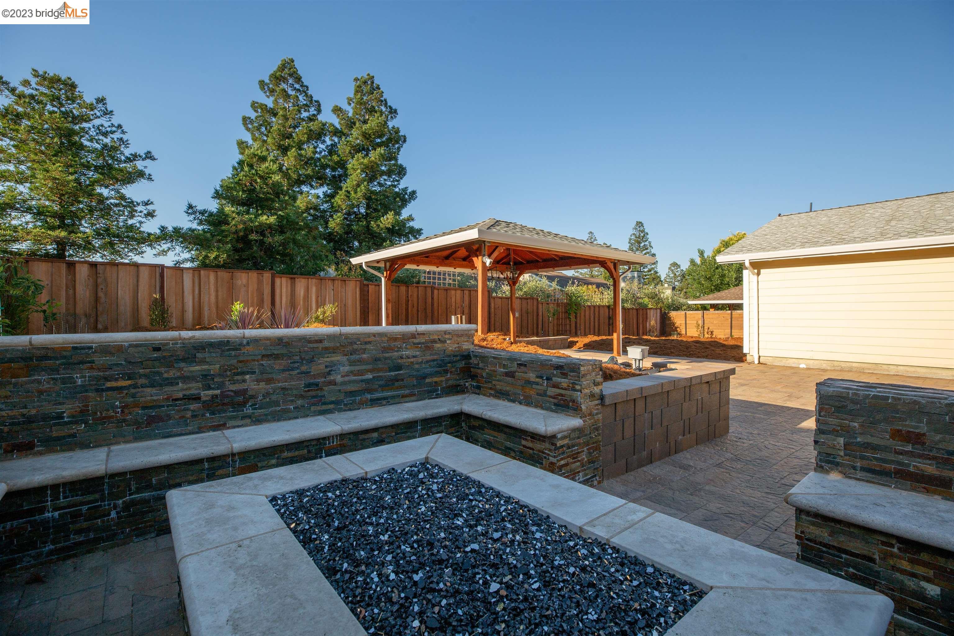 2191 Pleasant Hill Road Pleasant Hill, CA 94523 - Photo 26 of 35 a view of a chairs and tables in the back yard of the house