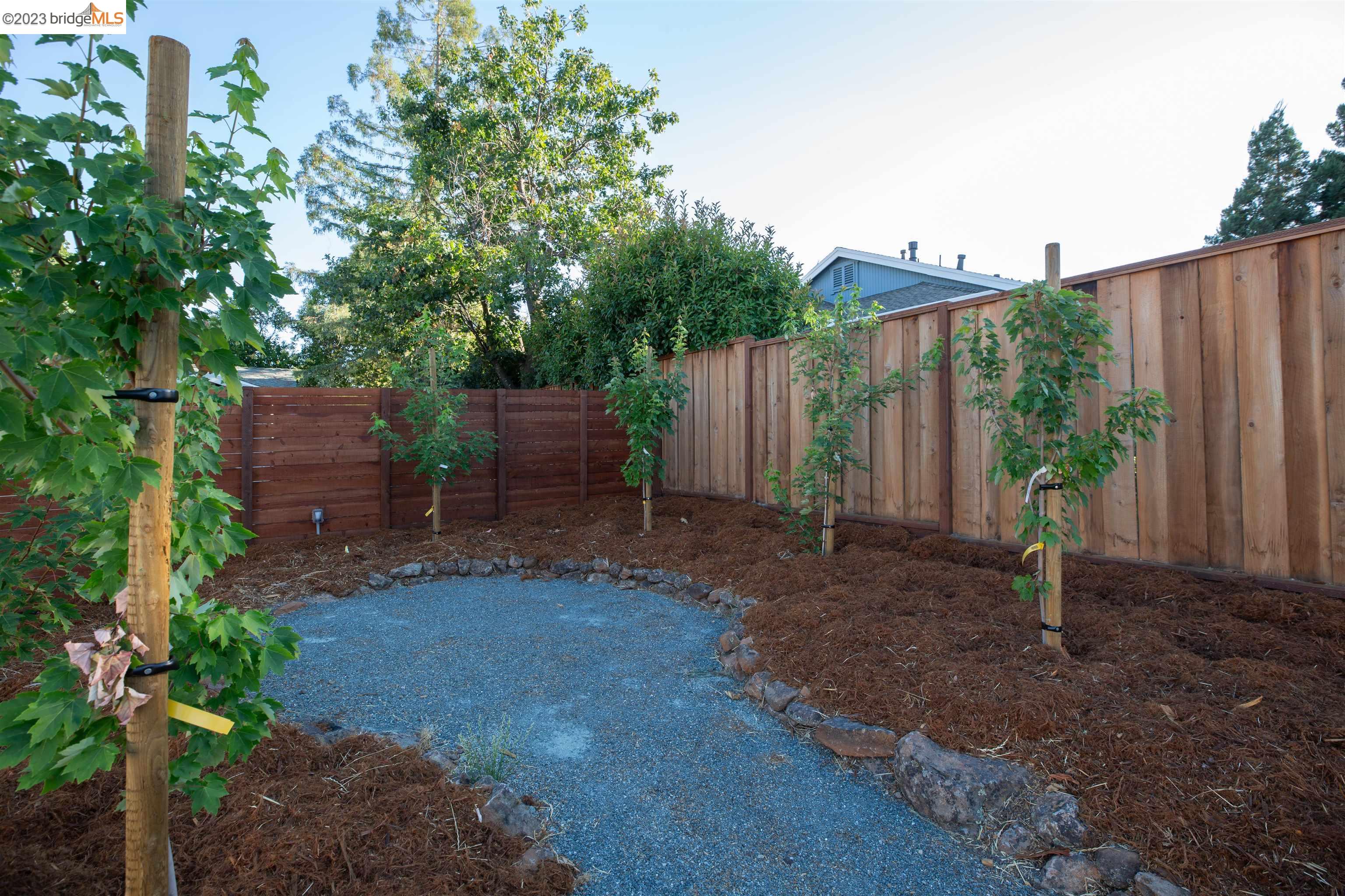 2191 Pleasant Hill Road Pleasant Hill, CA 94523 - Photo 31 of 35 a view of a backyard with plants and outdoor seating