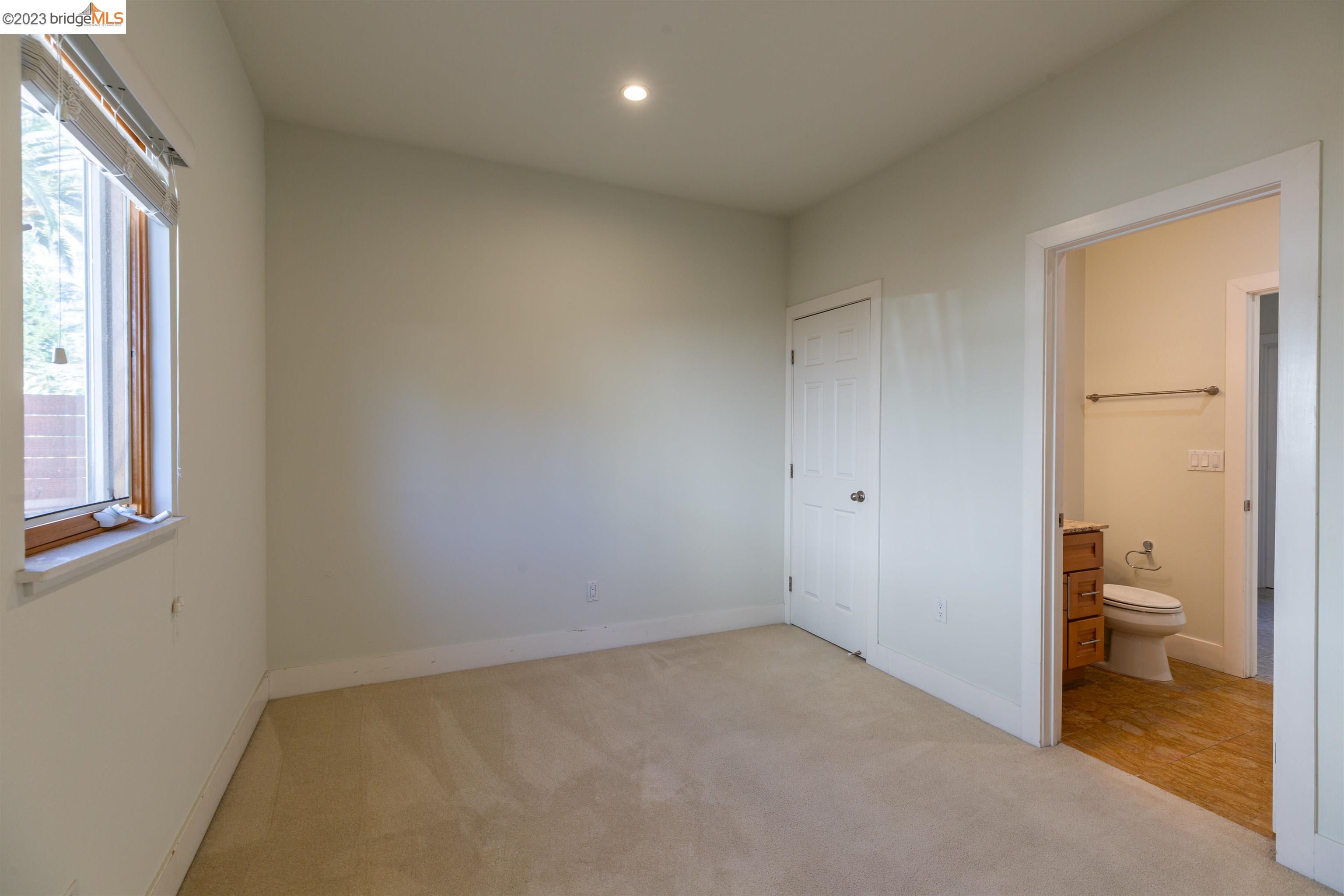 2191 Pleasant Hill Road Pleasant Hill, CA 94523 - Photo 6 of 35 an empty room and a bathroom with a toilet