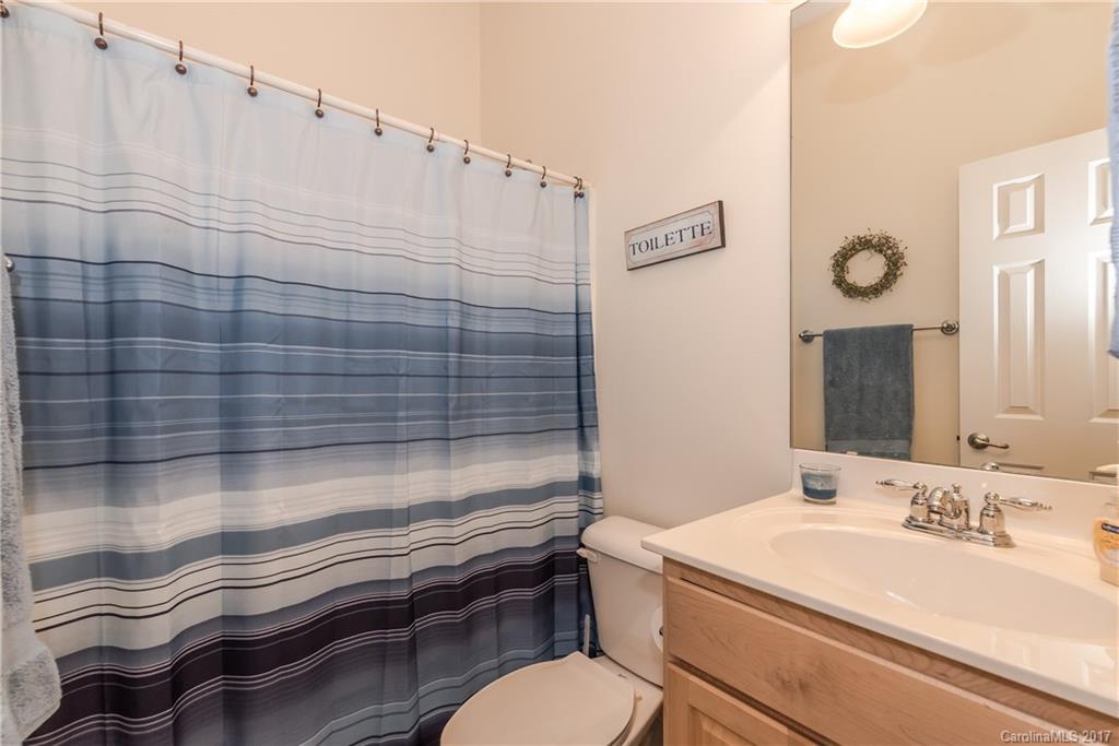 405 Esther Court, Unit 791 Fort Mill, SC 29708 - Photo 22 of 24 a bathroom with a sink a toilet and shower