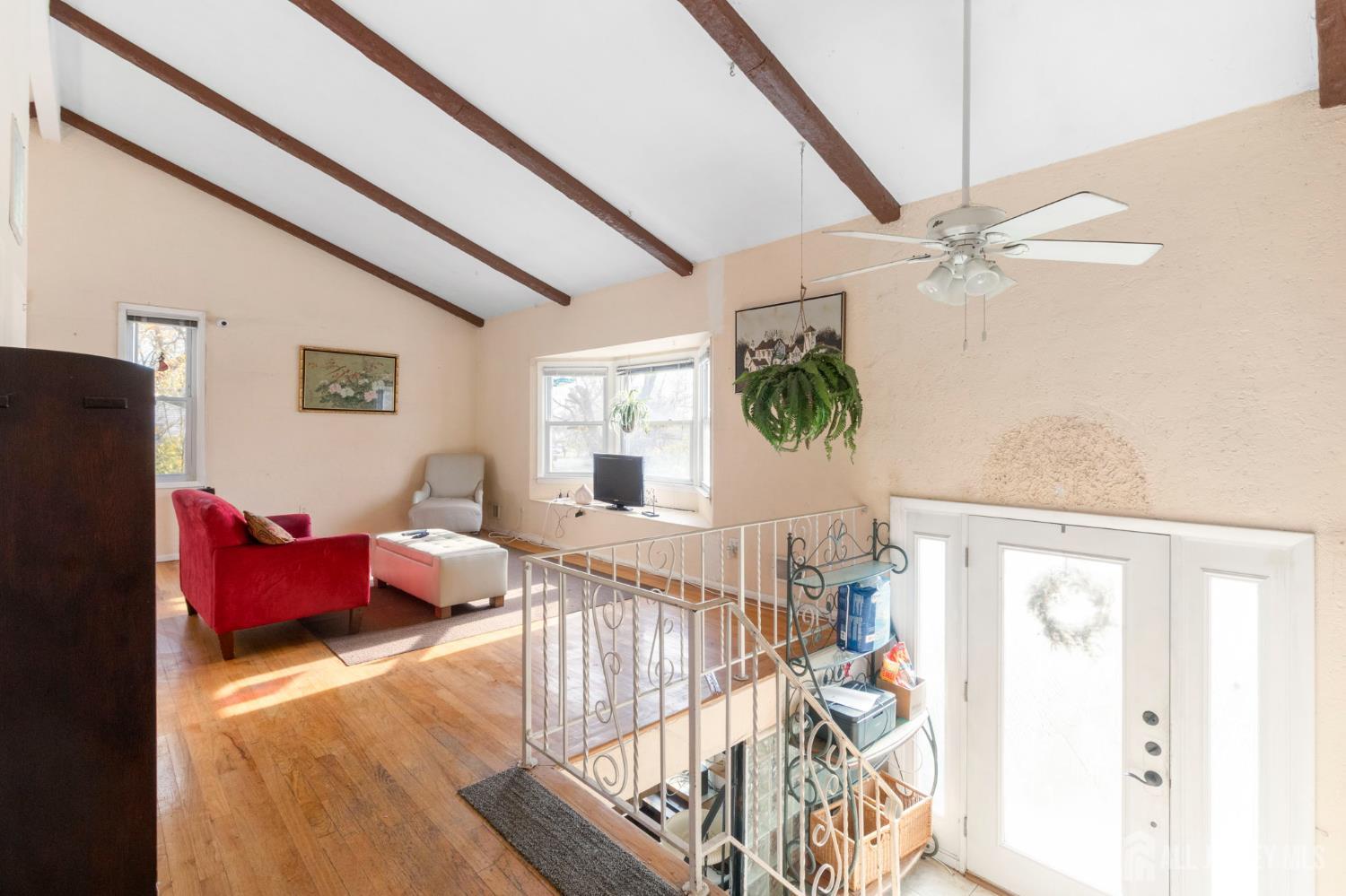 55 Sullivan Way East Brunswick, NJ 08816 - Photo 13 of 38 a view of a livingroom with furniture and a flat screen tv