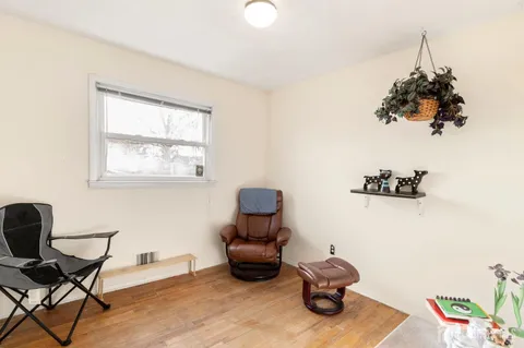 a room with a window and gym chair