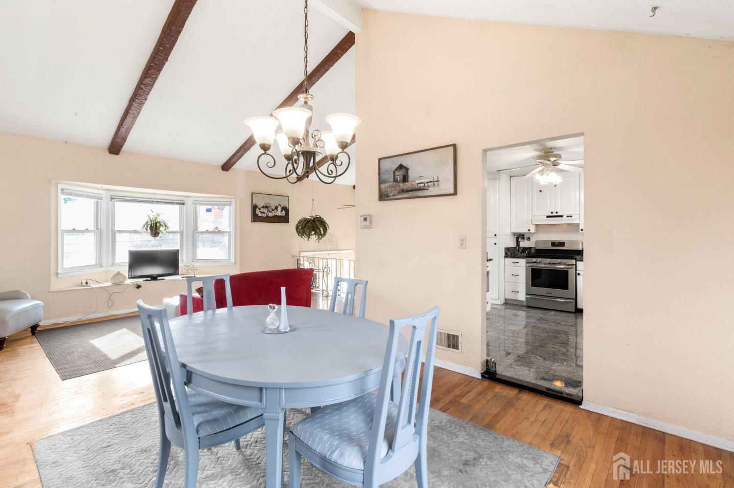 55 Sullivan Way East Brunswick, NJ 08816 - Photo 23 of 38 a view of a dining room with furniture and wooden floor