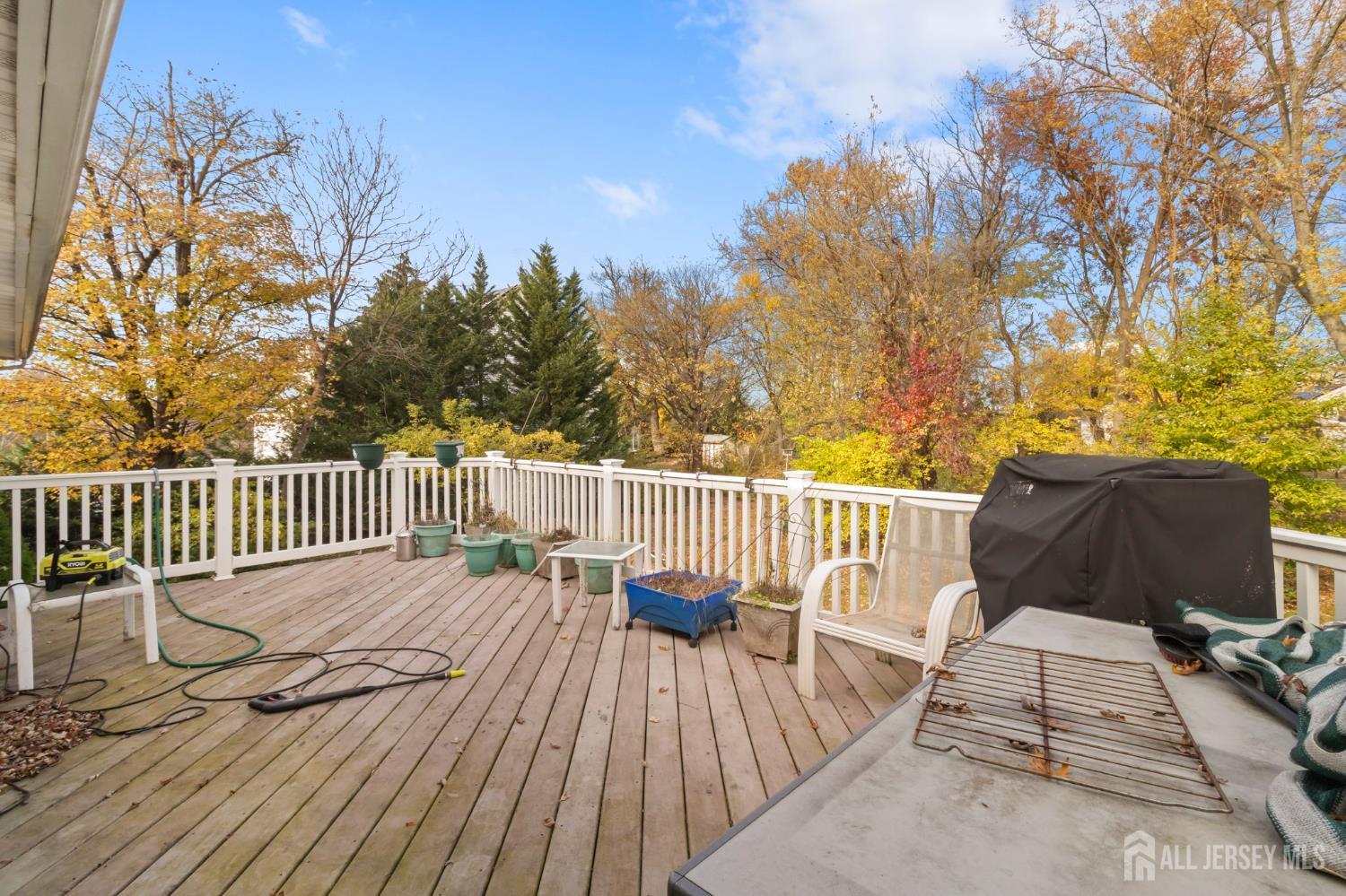 55 Sullivan Way East Brunswick, NJ 08816 - Photo 26 of 38 a view of a wooden deck with a patio