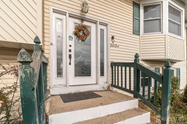 a view of a house with a door and a window