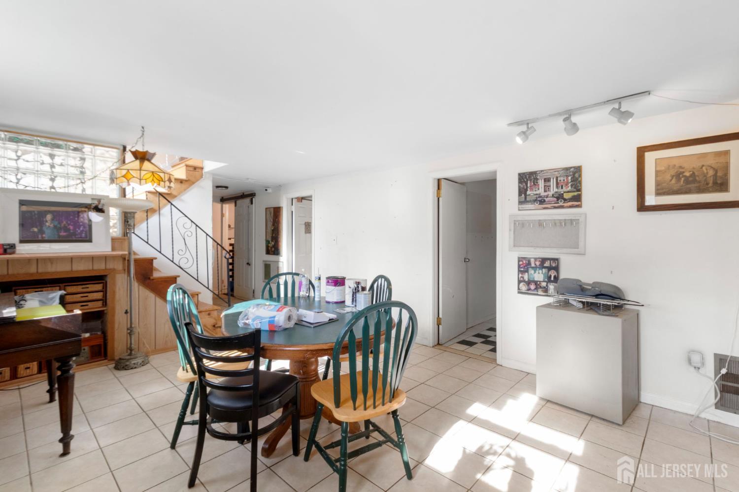 55 Sullivan Way East Brunswick, NJ 08816 - Photo 8 of 38 a view of a dining room with furniture and a chandelier