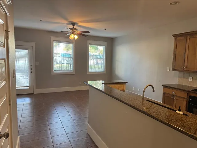 a kitchen with a sink and a stove