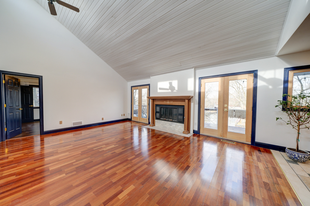 422 Castle Road McHenry, IL 60050 - Photo 11 of 24 a view of empty room with wooden floor and fireplace