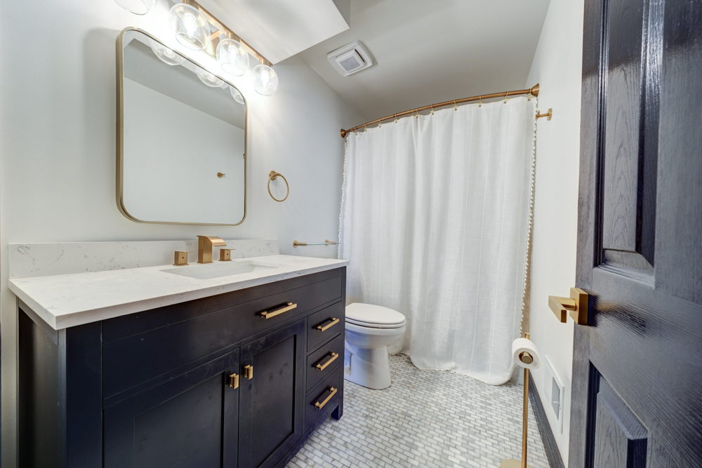 422 Castle Road McHenry, IL 60050 - Photo 20 of 24 a bathroom with a double vanity sink toilet and a mirror