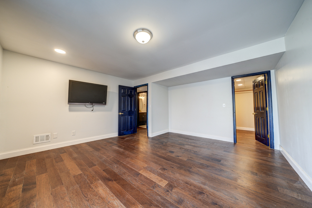 422 Castle Road McHenry, IL 60050 - Photo 22 of 24 a view of an empty room with wooden floor and a window
