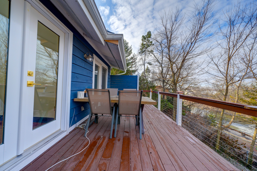 422 Castle Road McHenry, IL 60050 - Photo 3 of 24 a view of two chairs in the balcony with wooden floor