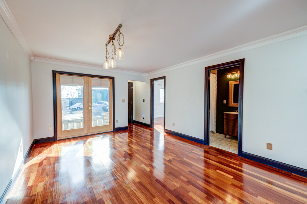 422 Castle Road McHenry, IL 60050 - Photo 8 of 24 a view of an empty room with wooden floor and a window