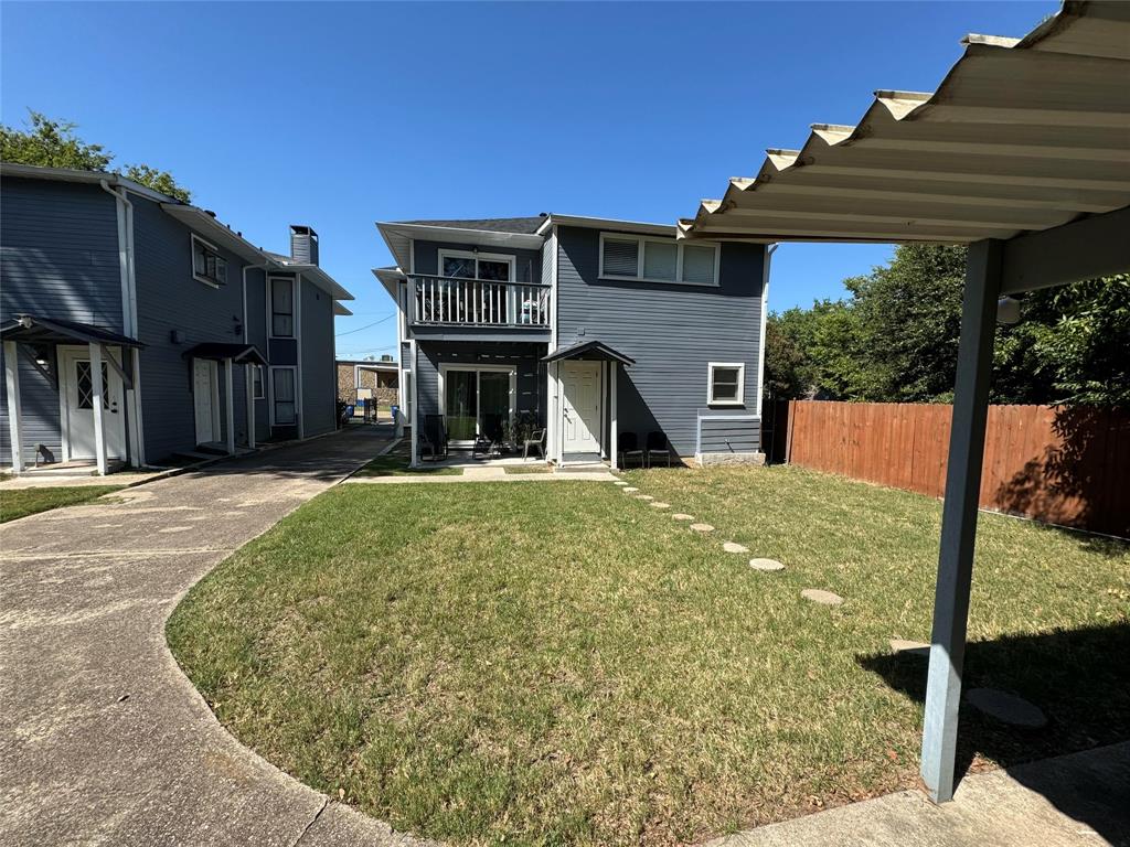 4512 Sycamore Street Dallas, TX 75204 - Photo 20 of 23 Back of property showing driveway and back porch