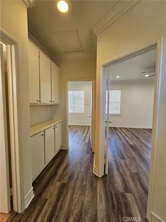 a bathroom with a granite countertop sink a toilet and a mirror
