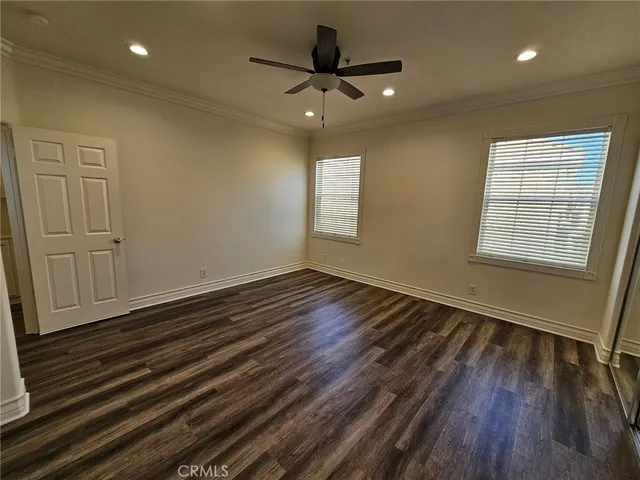 a patio with a table and chairs under an umbrella