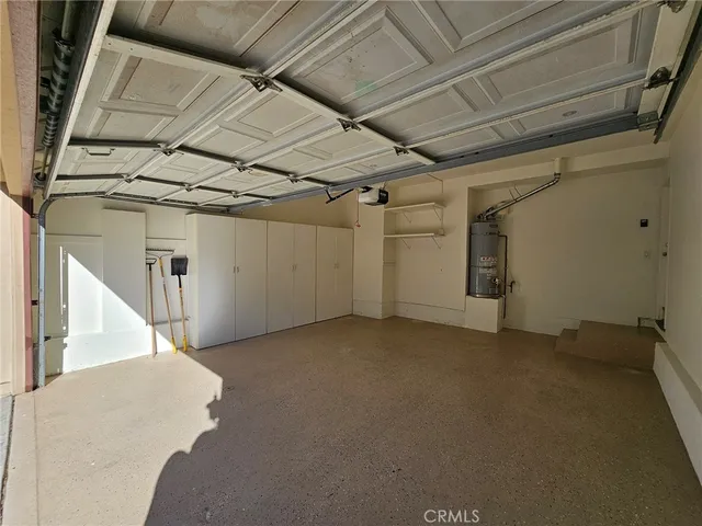 a view of a house with swimming pool and sitting area