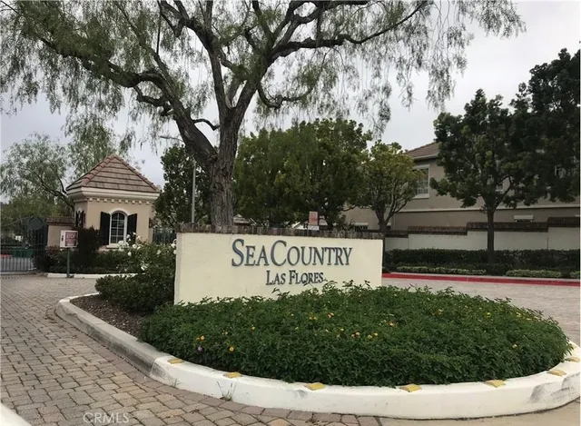 a view of a swimming pool with a patio and a garden