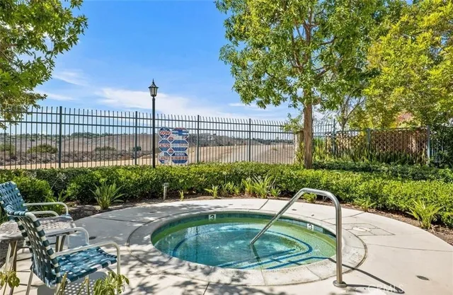 a view of a dry yard with mountains in the background
