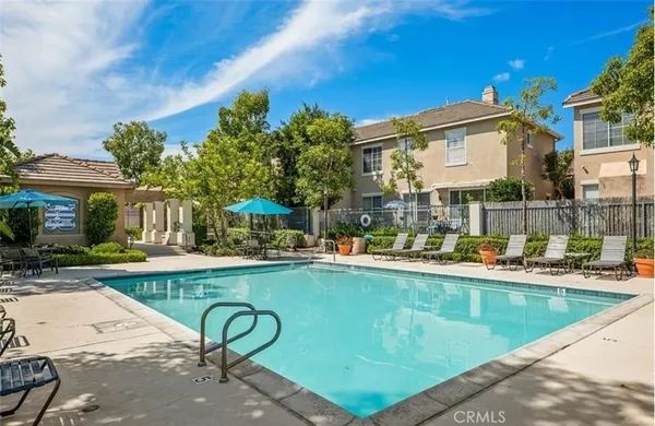 a view of a swimming pool with a patio
