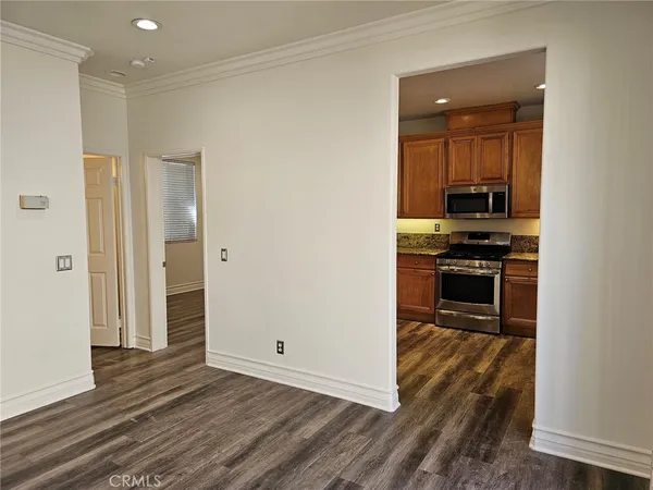 a kitchen with stainless steel appliances a stove sink and cabinets