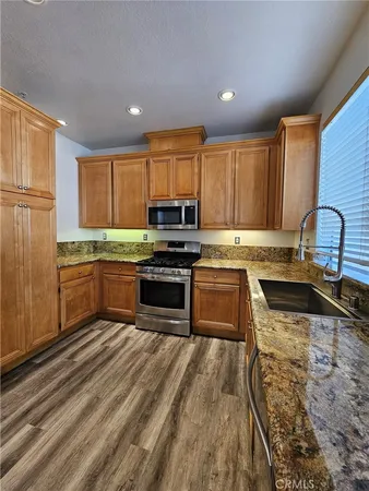 a kitchen with a sink and a window