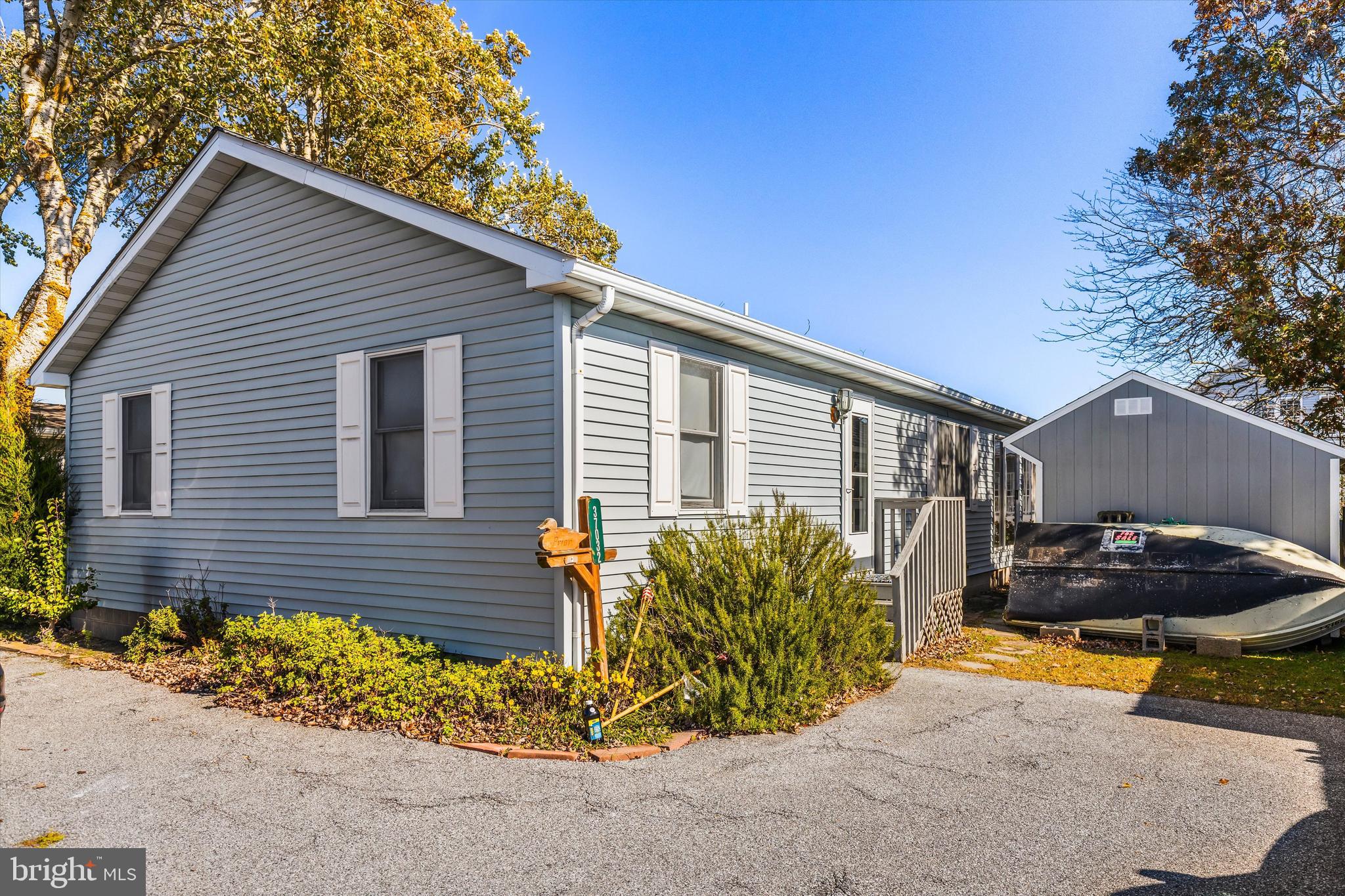 a view of a backyard with plants and a patio