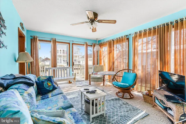 a living room filled with furniture and a flat screen tv