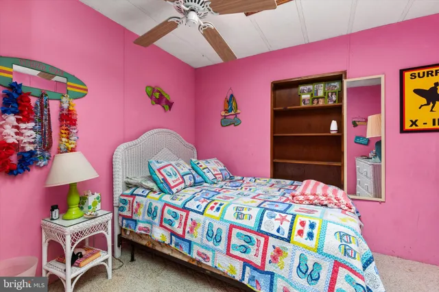 a bedroom with a bed and a dresser