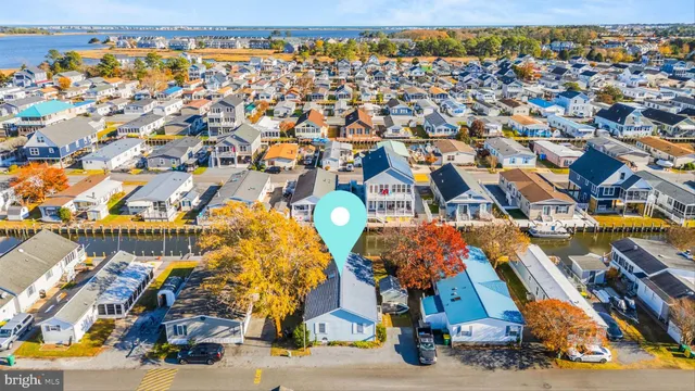 an aerial view of residential houses with city street
