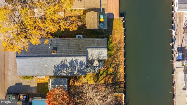 an aerial view of a pool patio outdoor seating and outdoor kitchen