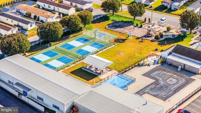 an aerial view of residential building and ocean