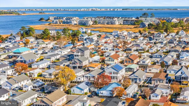 an aerial view of a house with a swimming pool
