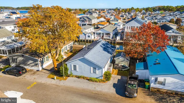 a view of a balcony with wooden floor and lake view