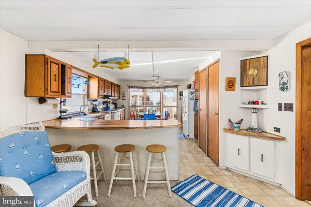 a kitchen with a refrigerator and a stove