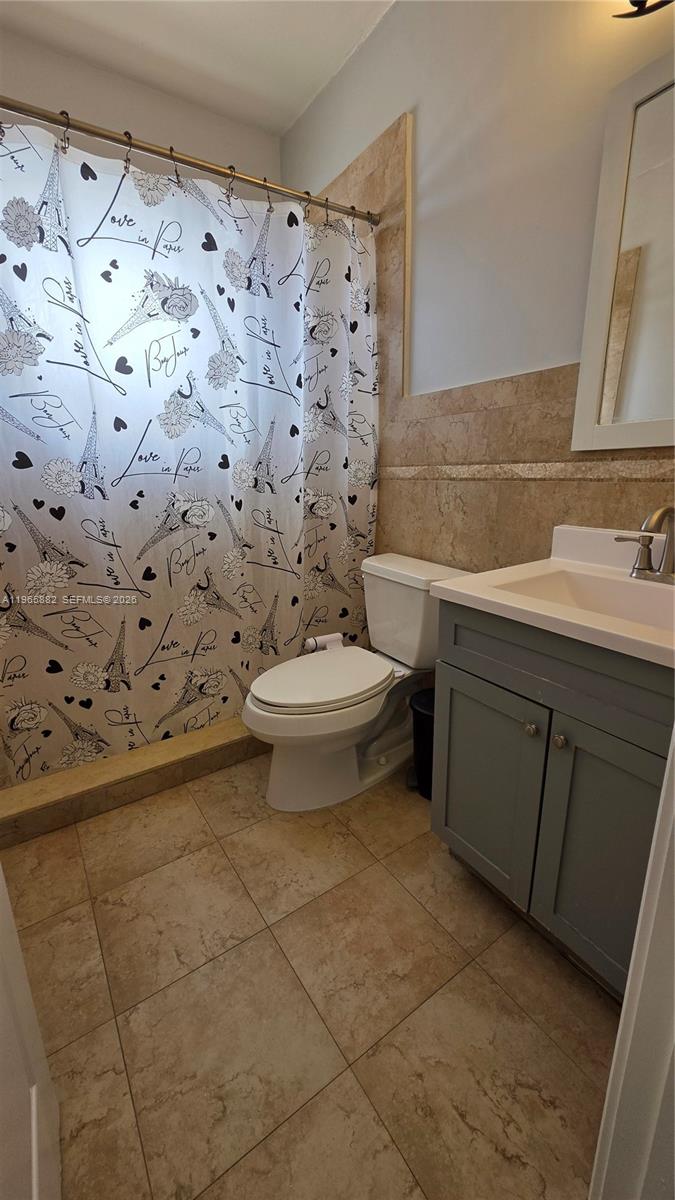 47 Northwest 47th Avenue, Unit 16 Miami, FL 33126 - Photo 8 of 10 a bathroom with a toilet and a sink