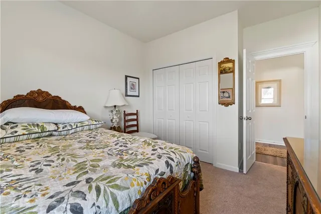 a bedroom with a bed and a cabinets