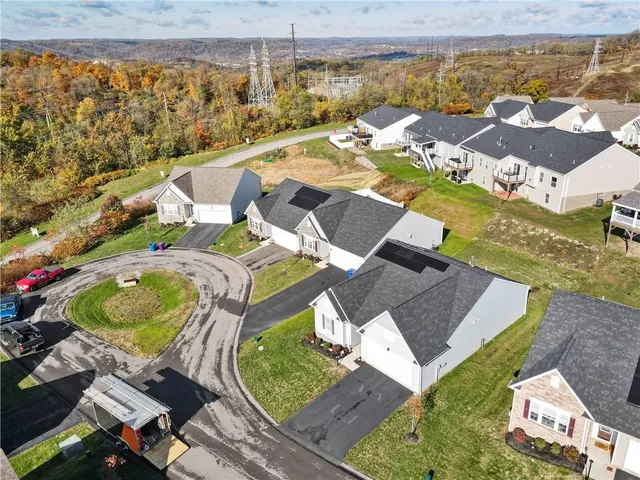 an aerial view of residential house with outdoor space