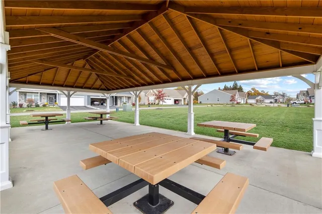 a patio with a table and chairs