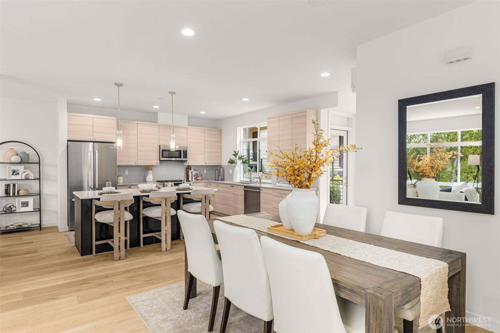a view of a dining room with furniture and a large window