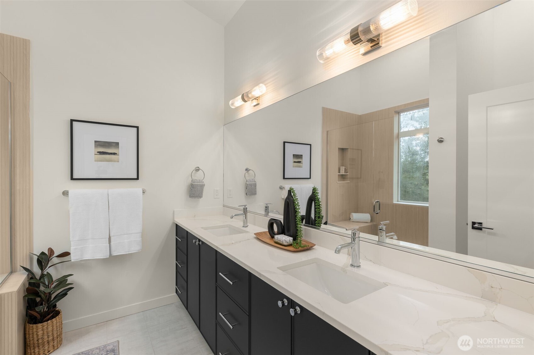16008 Main View Lane Northeast Duvall, WA 98019 - Photo 14 of 26 a bathroom with double vanity sinks a large mirror and a shower