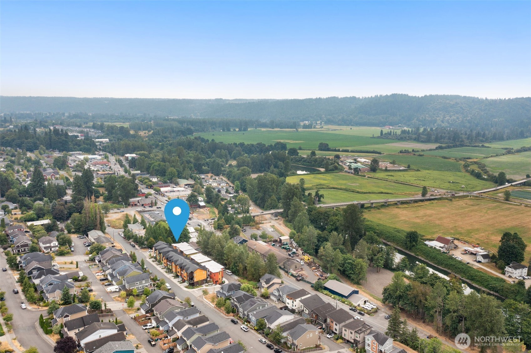 16008 Main View Lane Northeast Duvall, WA 98019 - Photo 25 of 26 a view of a town with mountains in the background