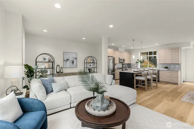 a living room with furniture kitchen view and a dining table