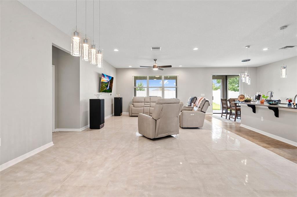 18565 Obregan Drive Spring Hill, FL 34610 - Photo 11 of 70 a living room with furniture and a flat screen tv