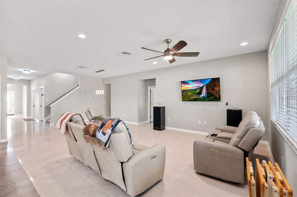 18565 Obregan Drive Spring Hill, FL 34610 - Photo 13 of 70 a living room with furniture and a flat screen tv